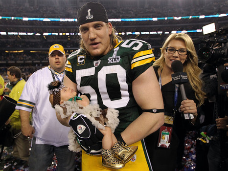 Packers LB AJ Hawk with daughter Lennon after Super Bowl XLV