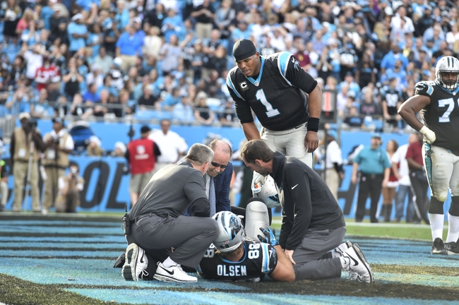 USATSI Panthers QB Cam Newton looks in on downed TE Greg Olsen, who avoided serious injury