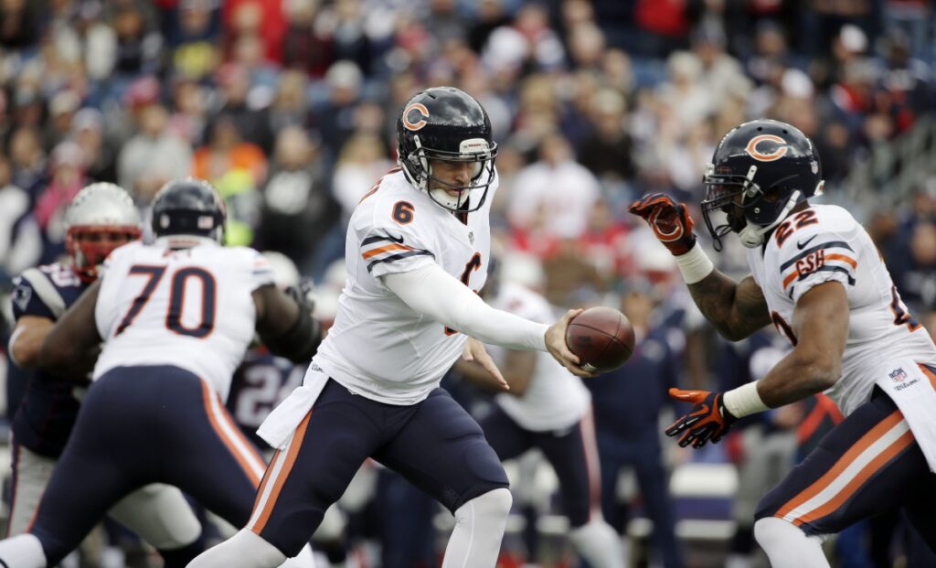 AP Image. Bears QB Jay Cutler hands off the football to RB Matt Forte in 2014 action.