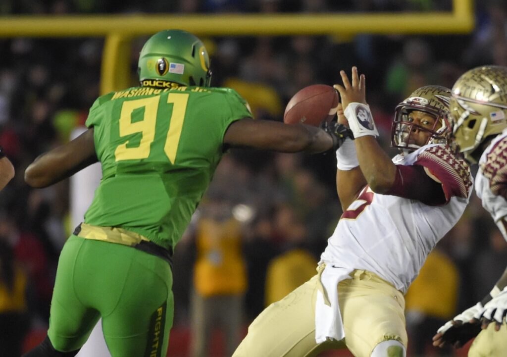 AP Image. FSU's Jamies Winston falls away from Oregon's Tony Washington before his fumble is returned for a touchdown.