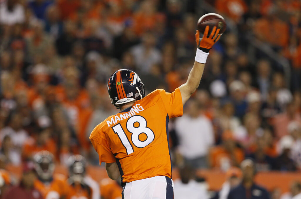 AP Image. Peytong Manning reduced his '15 compensation by $4 million, moving him out of the Top 5 salaried QBs.