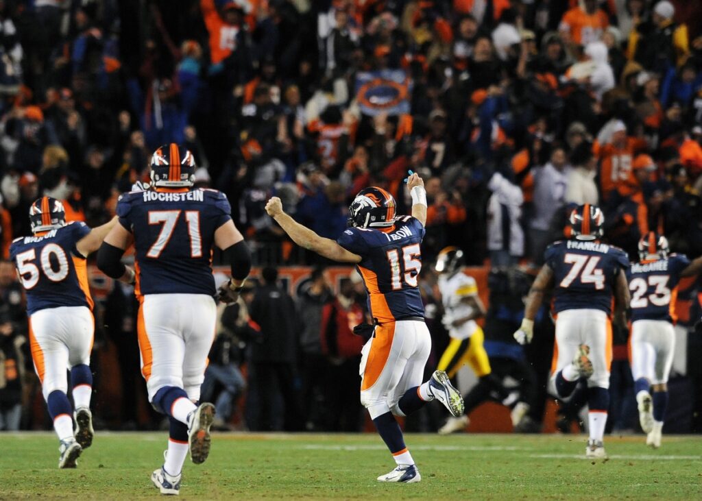 AP Photo. Broncos QB Tim Tebow celebrates game-winning TD pass in the 2011 Wild Card playoff game.