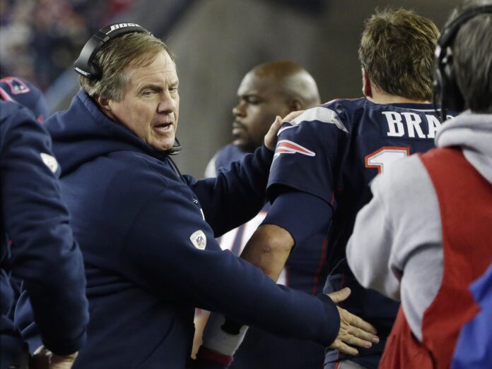 AP Photo. New England Patriots head coach Bill Belichick congratulates Tom Brady