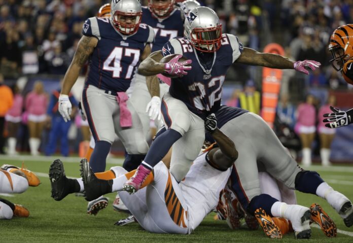 AP Photo. The Patriots found themselves against the Bengals through a bruising run game.