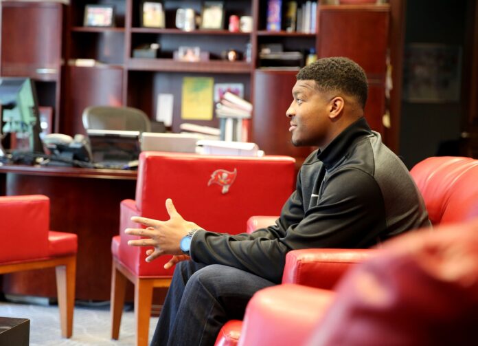 Image via buccaneers.com. Florida State QB Jameis Winston on his visit with the Tampa Bay Buccaneers