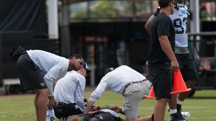 Jaguars 1st-round draft pick Dante Fowler lies on the grass after tearing his ACL in minicamp