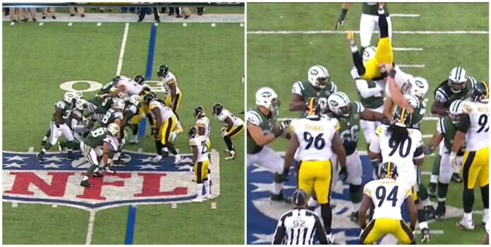 Pittsburgh's Mike Mitchell flies over the pile while the Jets are in victory formation