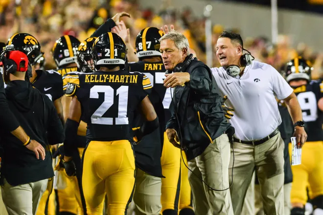 Iowa Head Coach Kirk Ferentz And Assistant Coach Brian Ferentz React With Running Back Ivory Kelly-Martin (21) During The Wisconsin Game. 