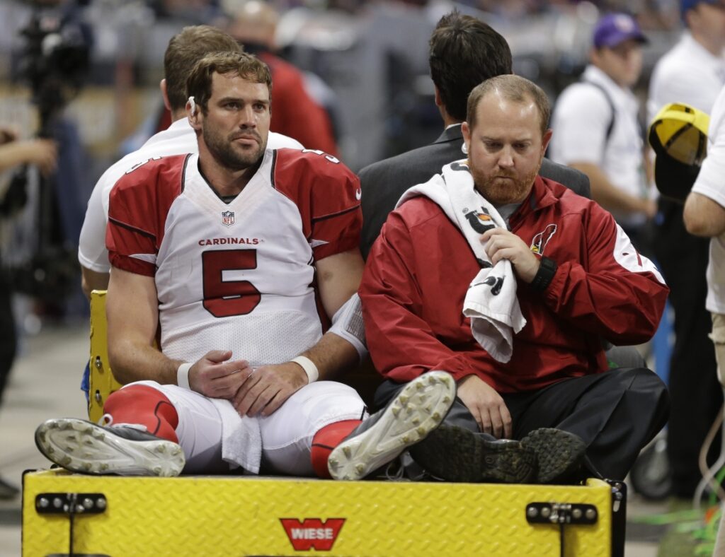AP Image. Arizona QB Drew Stanton carted off the field after sustaining a knee injury.