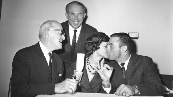On December 29, 1964, Joy Piccolo Tenderly Kissed Her Husband, Brian Piccolo, After He Put Pen to Paper on His Contract with the Chicago Bears